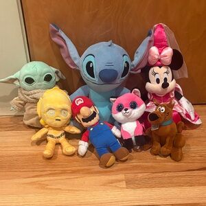 Plushie pile!!! Minnie Mouse, stitch, Mario, ect.